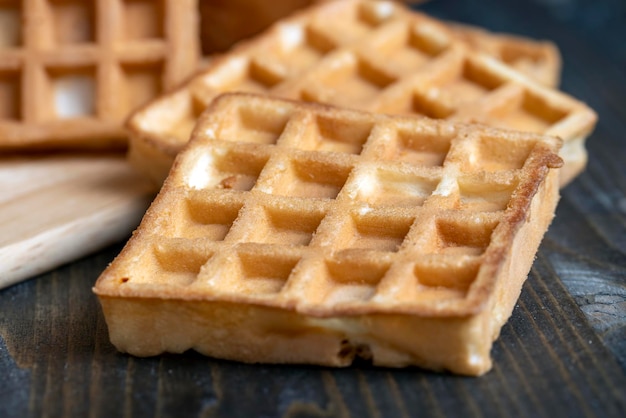 Square sweet soft waffles on the table