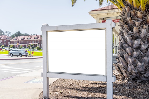 Square white billboard in a modern city