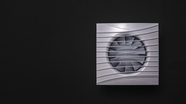 Photo square white duct fan on a black background