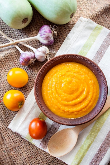 Squash caviar with garlic and tomatoes in a rustic bowl