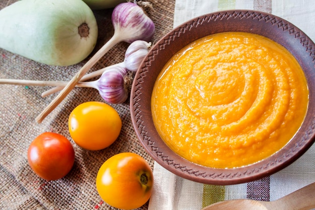 Squash caviar with garlic and tomatoes in a rustic bowl