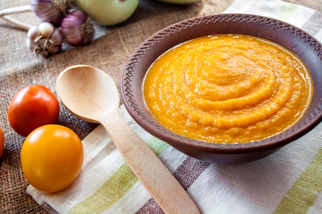 squash caviar with garlic and tomatoes in a rustic bowl