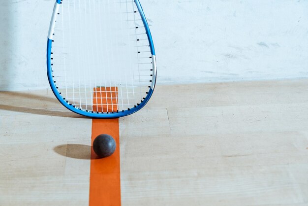 squash racket ball wooden floor