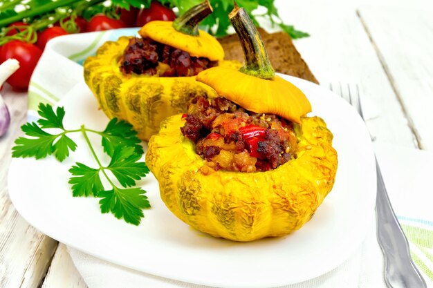 Squash yellow stuffed in white plate on board