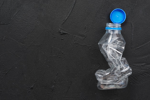 Photo squeezed empty plastic bottle