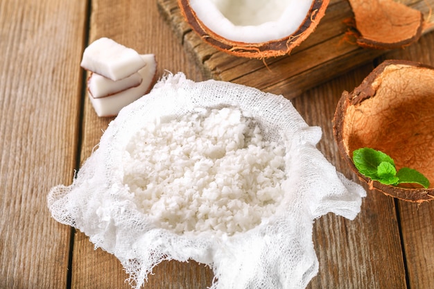 Squeezing milk from the chips of coconut 