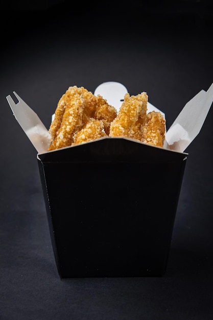 squid rings in batter on a dark background