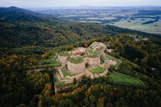 Srebrna Gora fortress and Sudety mountains at autumn season aerial drone view
