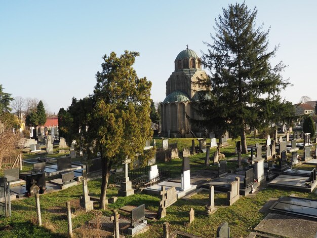 Sremska Mitrovica Serbia February 25 2021 Christian city modern cemetery Graves with stone monuments and crosses Granite headstones Crypt or chapel Funeral or Halloween theme