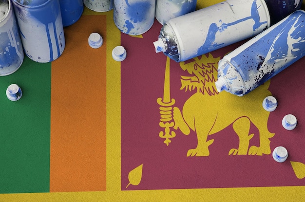 Sri Lanka flag and few used aerosol spray cans for graffiti painting Street art culture concept