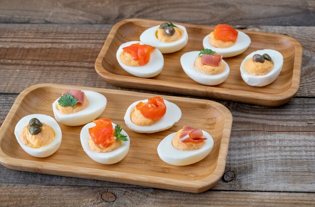 Sriracha deviled eggs with different toppings