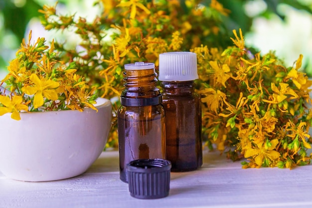 St John's wort essential oil in a small bottle Selective focus