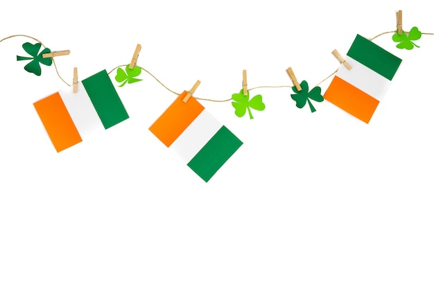 St. Patrick's Day garlands with flag and cloverleaf decorations. Copy space.
