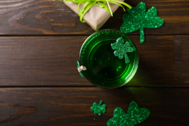 St. Patrick's Day Green Beer pint, decorated with shamrock leaves. Patrick Day pub party, celebrating.