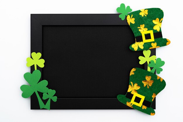 St Patricks day, festive leprechaun hat and green Shamrocks on photo frame