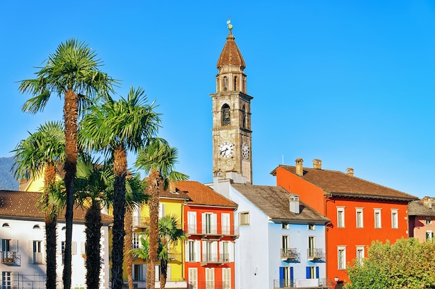 St Peter and Paul church tower and old colorful buildings at the luxurious resort in Ascona on Lake Maggiore, Ticino canton, in Switzerland.