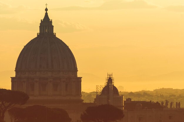 St Peter's basilica dome at sunrise in Rome Italy