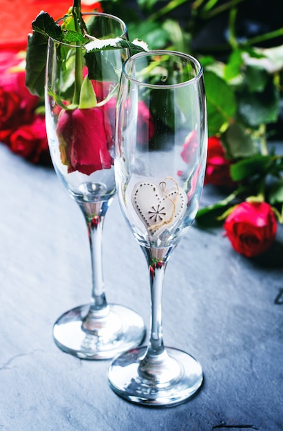 St Valentine decoration with roses bouquet and champagne glasses