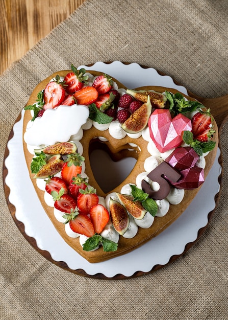 St. Valentine's Day Cake in heart shape. Romantic present. Sweet Valentine. Bakery, confectionery concept