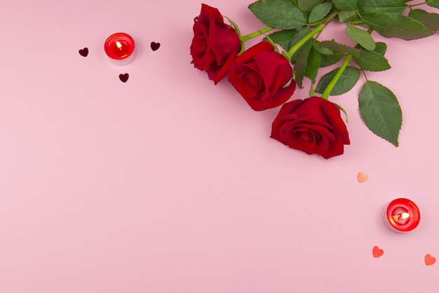 St. Valentine's day concept on a pink background with decorations. The concept of the St. Valentine's day, weddings, engagements, Mother's Day, birthday,  Christmas and other holidays. Flat fly