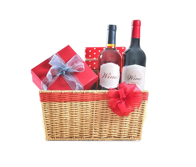 St Valentines Day concept Two wine bottles and gift boxes in basket isolated on white