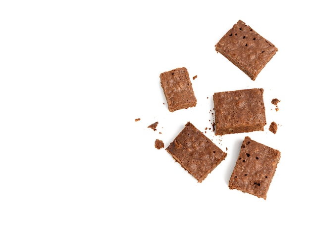 Photo stack of baked chocolate brownie pieces with walnut isolated on white background delicious dessert