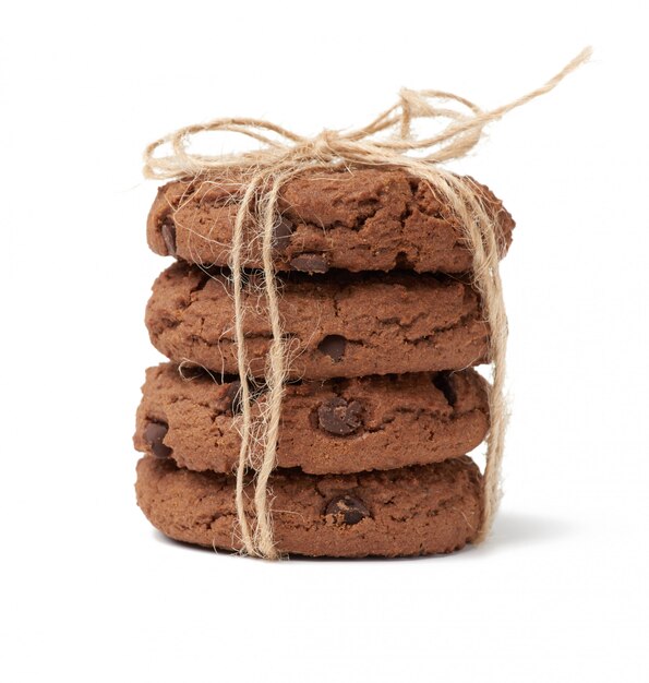 Stack of baked round chocolate chip cookies isolated on a white background