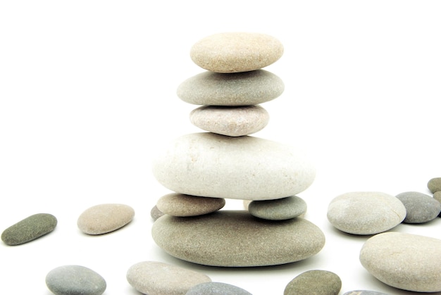 Stack of balanced stones on a white background