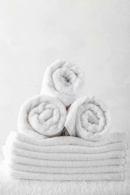 Stack of bath towels on wooden table