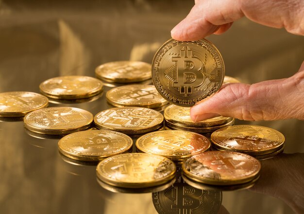 Stack of bitcoins with gold background