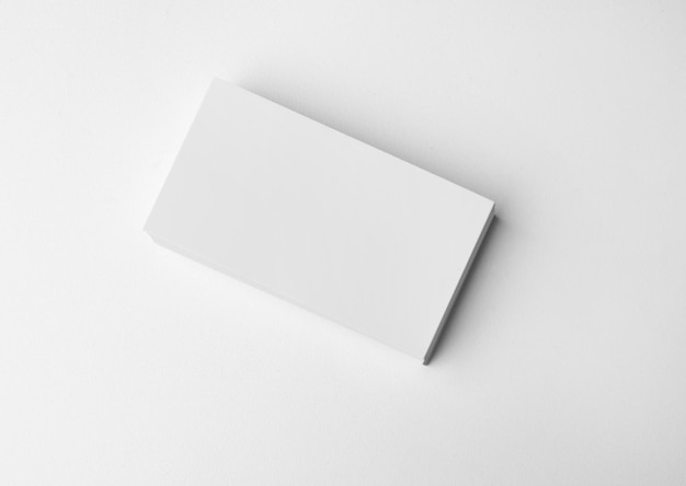 Stack of blank business cards on white background