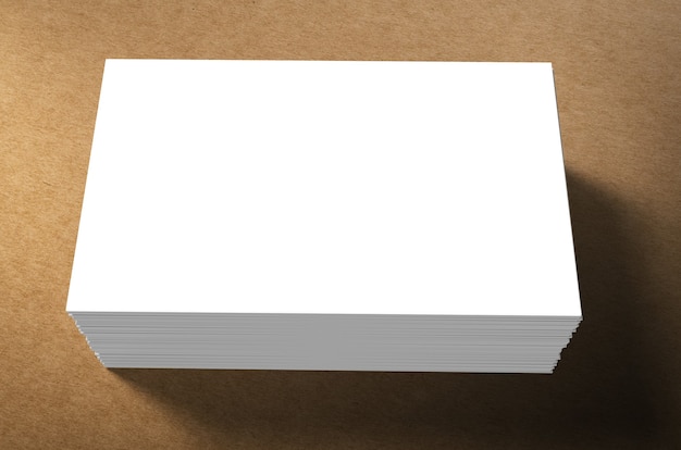 Stack of blank name cards on brown background