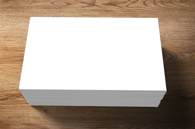 Stack of blank name cards on wooden background