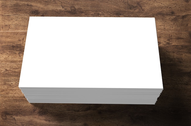 Stack of blank name cards on wooden background