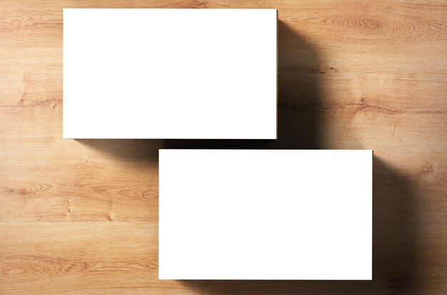 Photo stack of blank name cards on wooden background