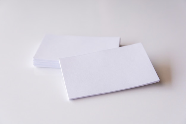 Stack of blank white business cards. Mockup business cards on white background 