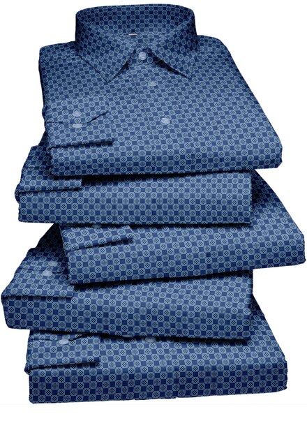 A stack of blue cotton sheets with a dark blue pattern on the front.