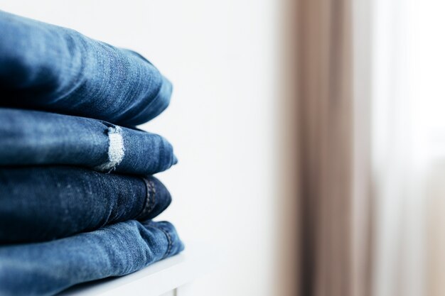 A stack of blue denim jeans or pants.