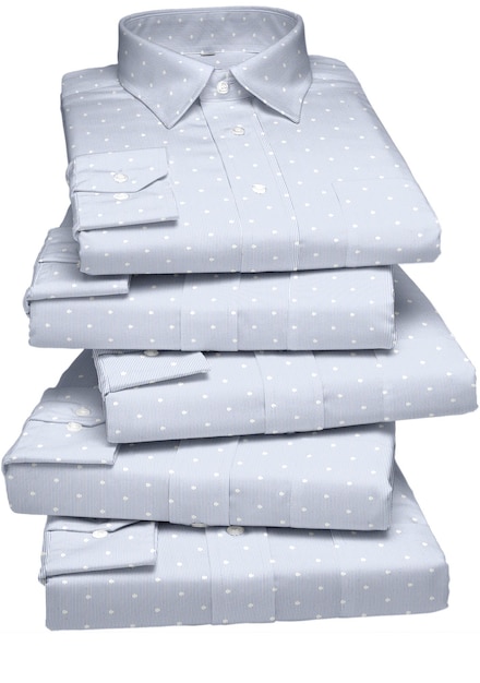 A stack of blue and white shirts with white dots on them