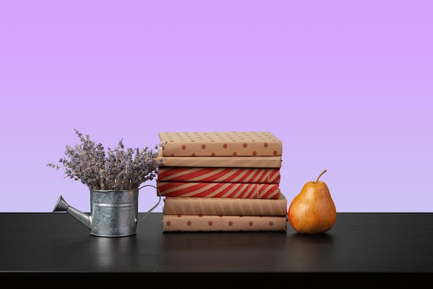 Stack of books on black wooden table