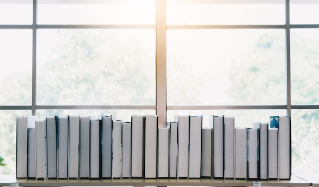 Stack of books on the book shelf in the house