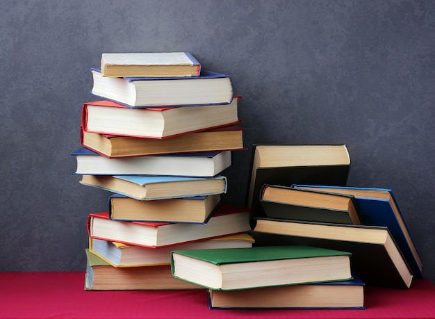 Stack of books in the colored covers on the table 