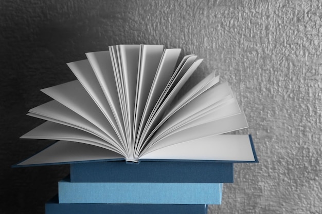 Stack of books on gray background
