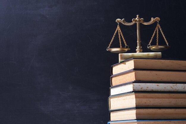 Photo stack of books and libra scale