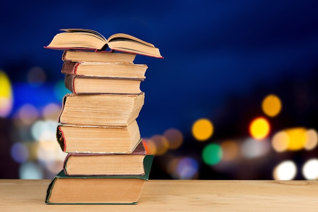 Stack of books over the natural background