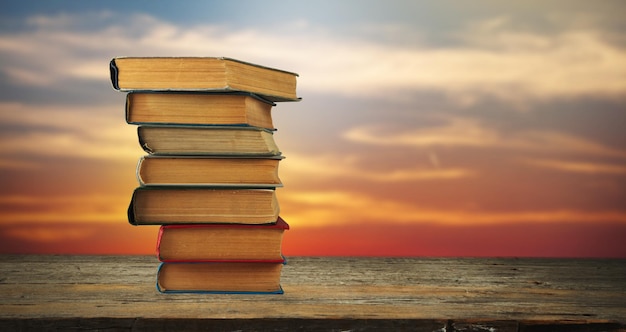 Stack of books in sunset