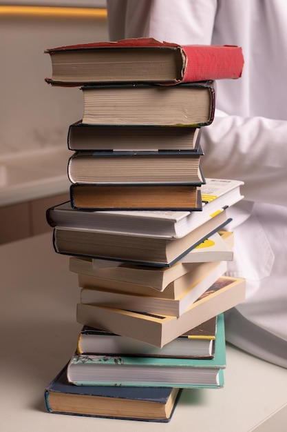 A stack of books on the table. High quality photo