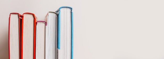 A stack of books on white surface