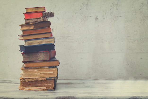 Stack of books on white wooden