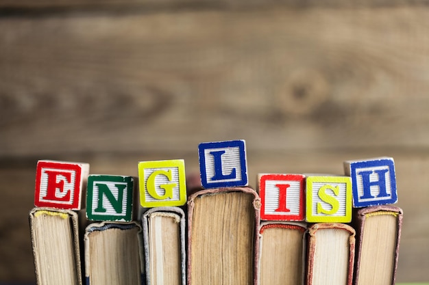 Stack of books with English word on background